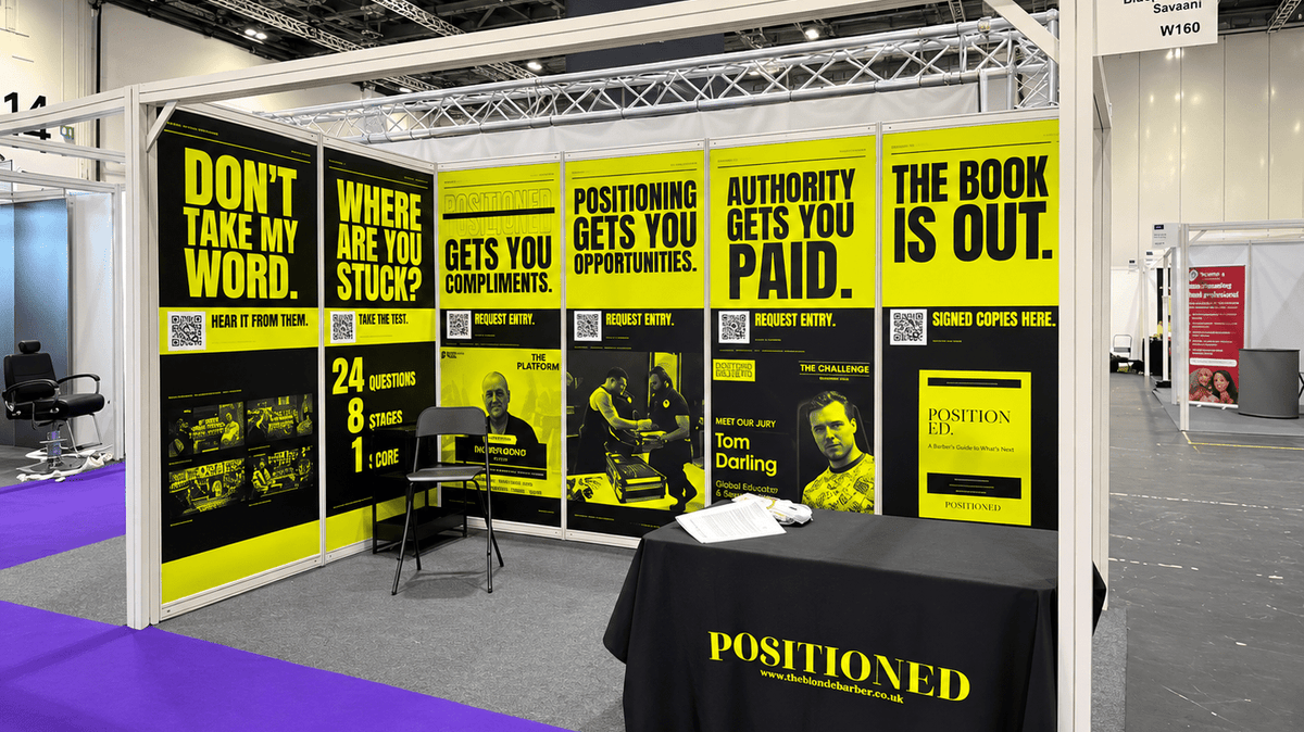 Yellow and black shell scheme exhibition graphics with bold headlines and QR codes