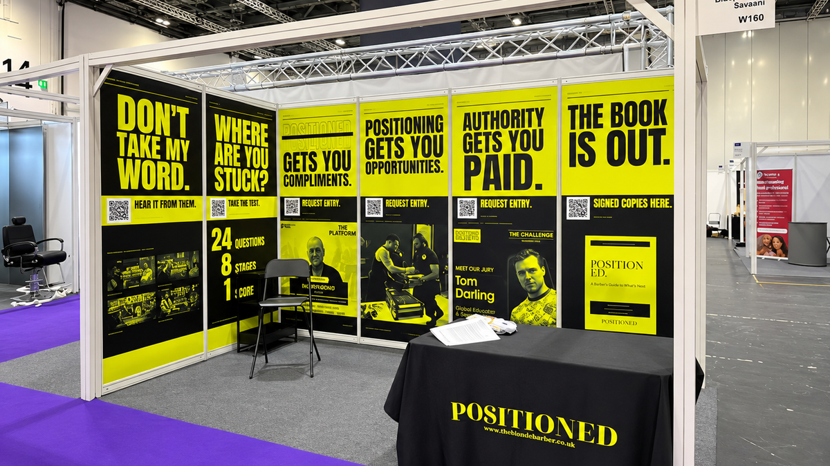 Yellow and black shell scheme exhibition graphics with bold headlines and QR codes