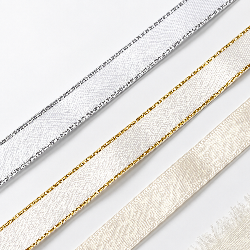 a collection of ribbons with different colors and patterns, including silver, white, and gold.