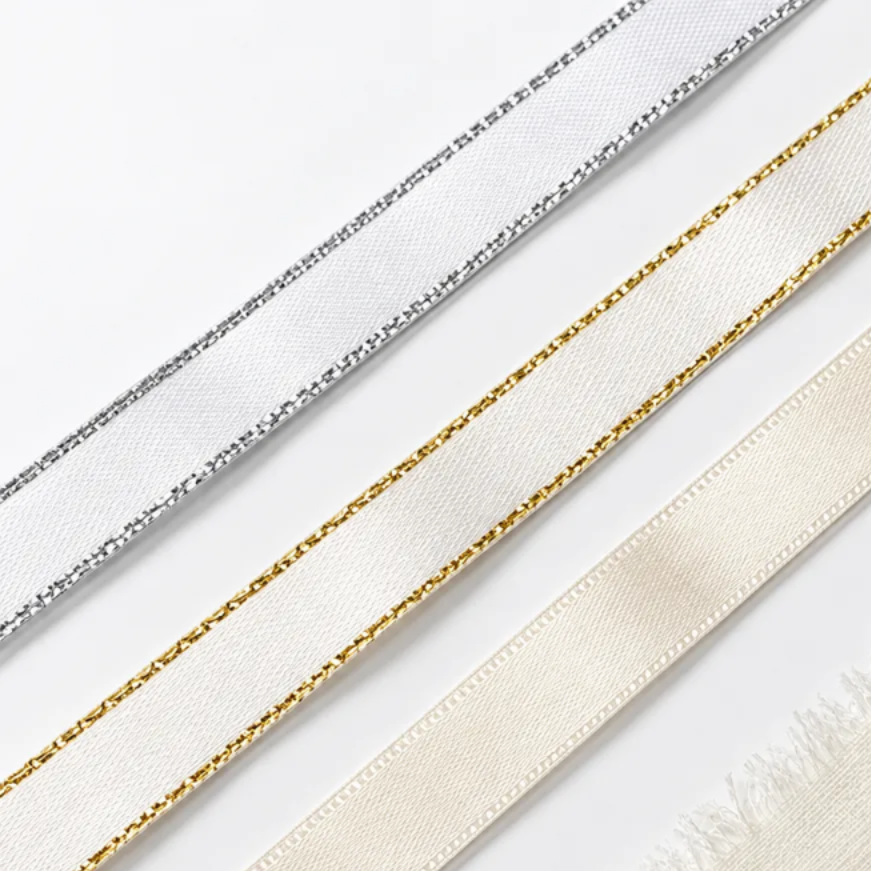 a collection of four different ribbons, each with unique patterns and textures.