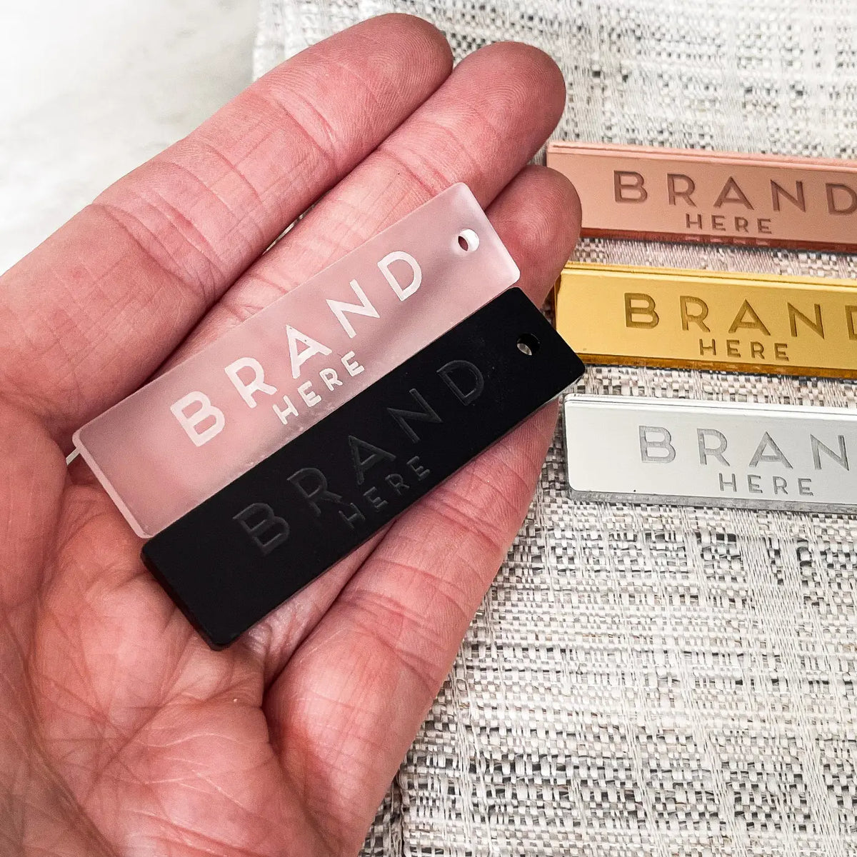 Customised brand labels – precision cut engraved acrylic tags | luxury branding