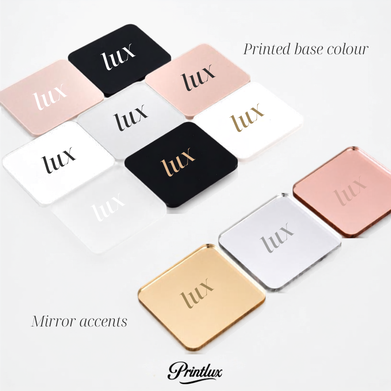 various colored square mirrors with the word "Lux" printed on them, arranged in a grid-like pattern.