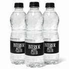 Three identical clear plastic bottles with black caps and labels that say "INTERIOR girls CLUB".