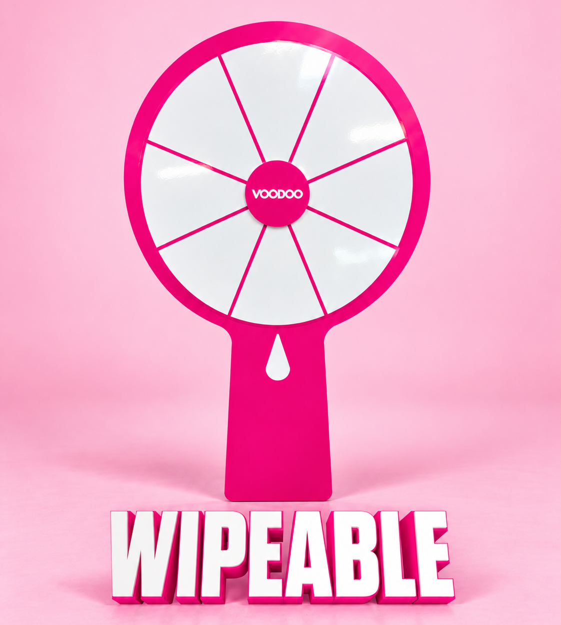 A pink and white spinning wheel toy with the word "WIPEABLE" written below it.