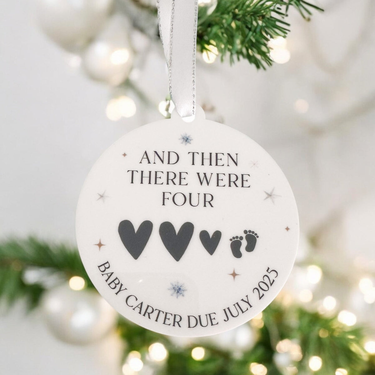 Personalised baby's first Christmas bauble featuring a custom name design