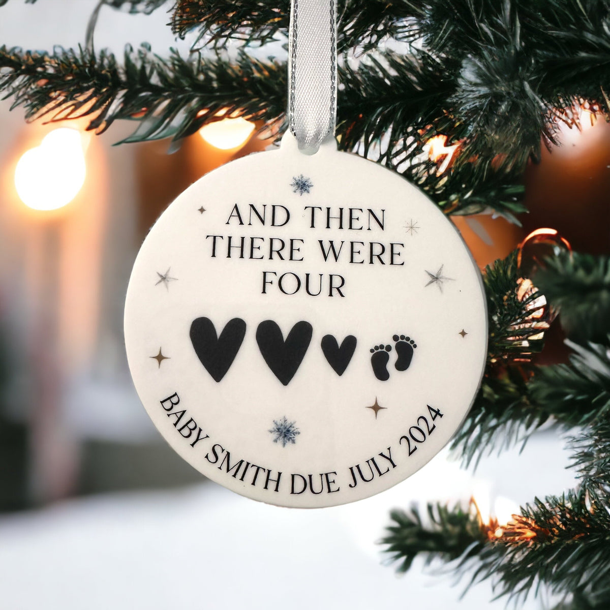 Personalised baby's first Christmas bauble with a custom name design for festive baby keepsakes