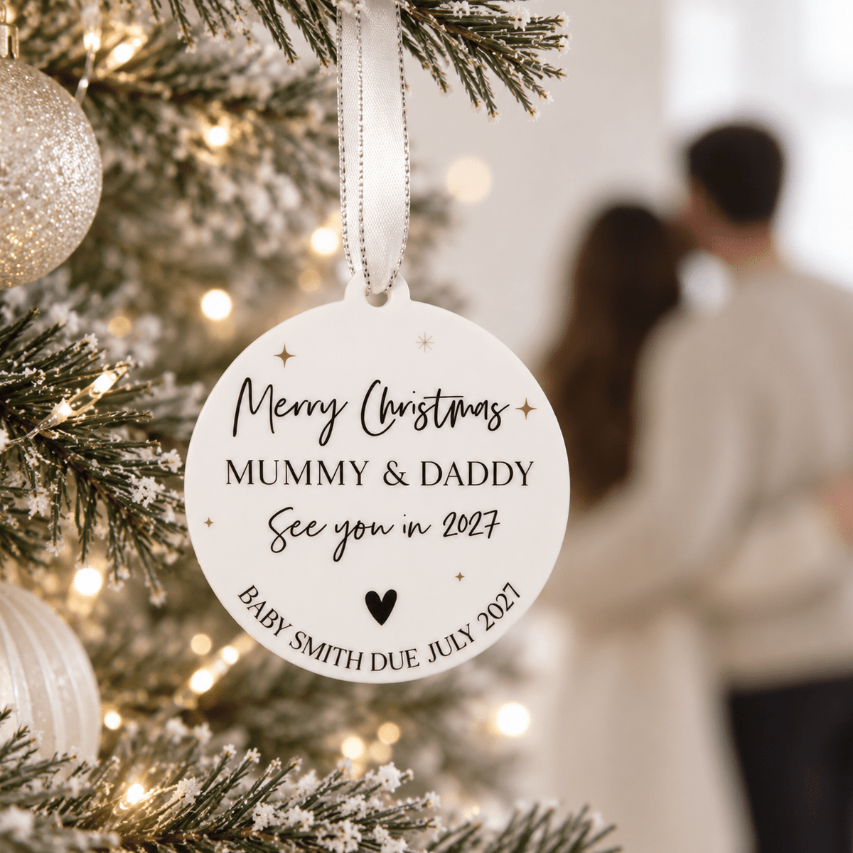 Personalised baby's first Christmas bauble with a custom name design for festive baby keepsakes