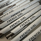 Stack of white pens corporate  text on a light background