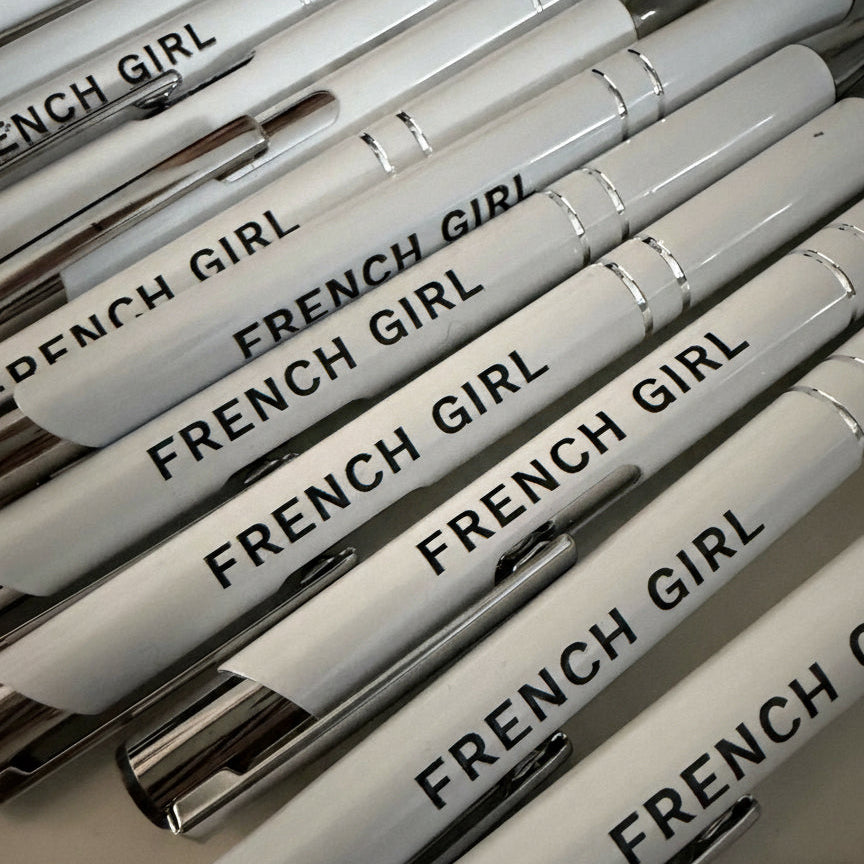 Stack of white pens corporate  text on a light background