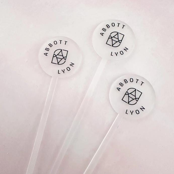Personalised Acrylic Drink Stirrers for company event drinks with a custom name design