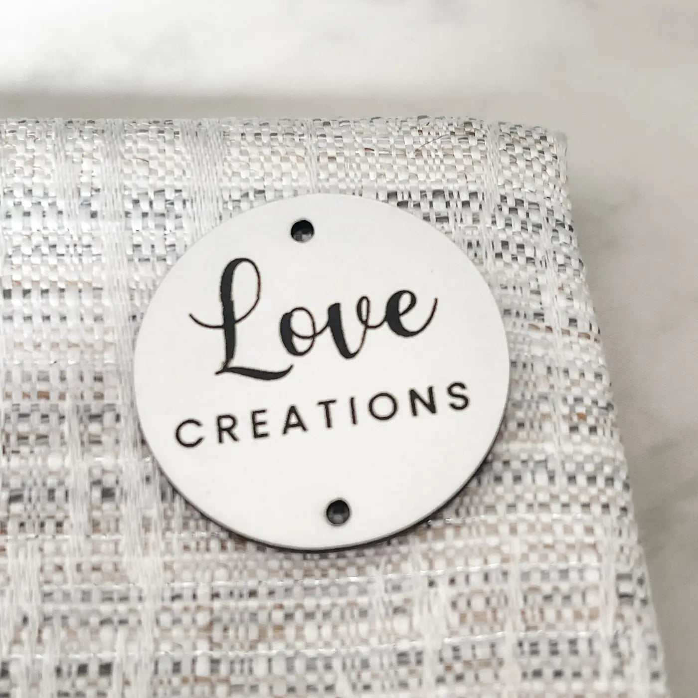 Personalised brand labels – custom acrylic tags | luxury sewing uk