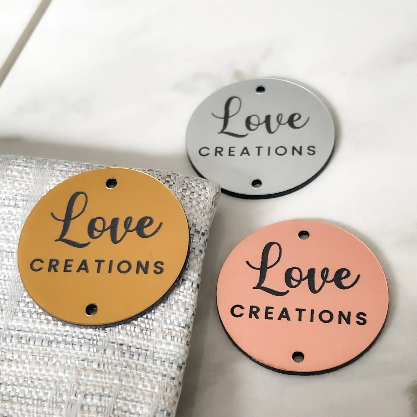 Personalised brand labels – custom acrylic tags | luxury sewing uk