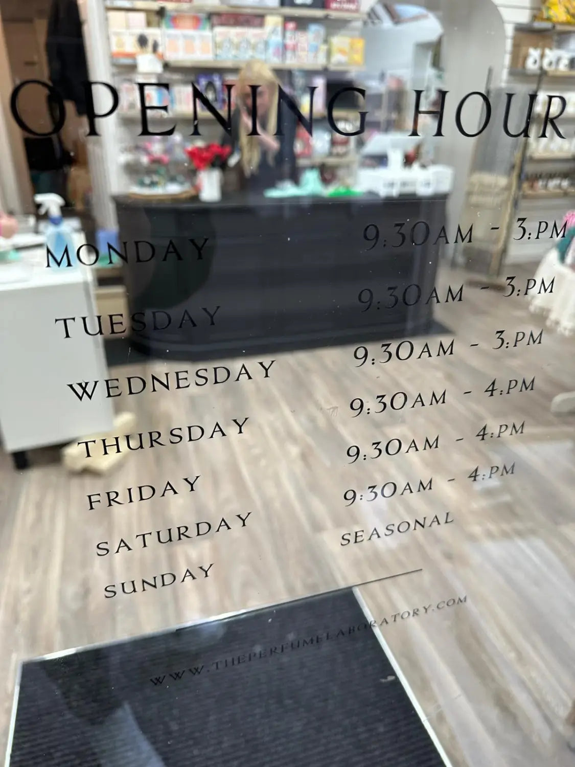 Perfume laboratory: monochrome shop signage designed to define the brand
